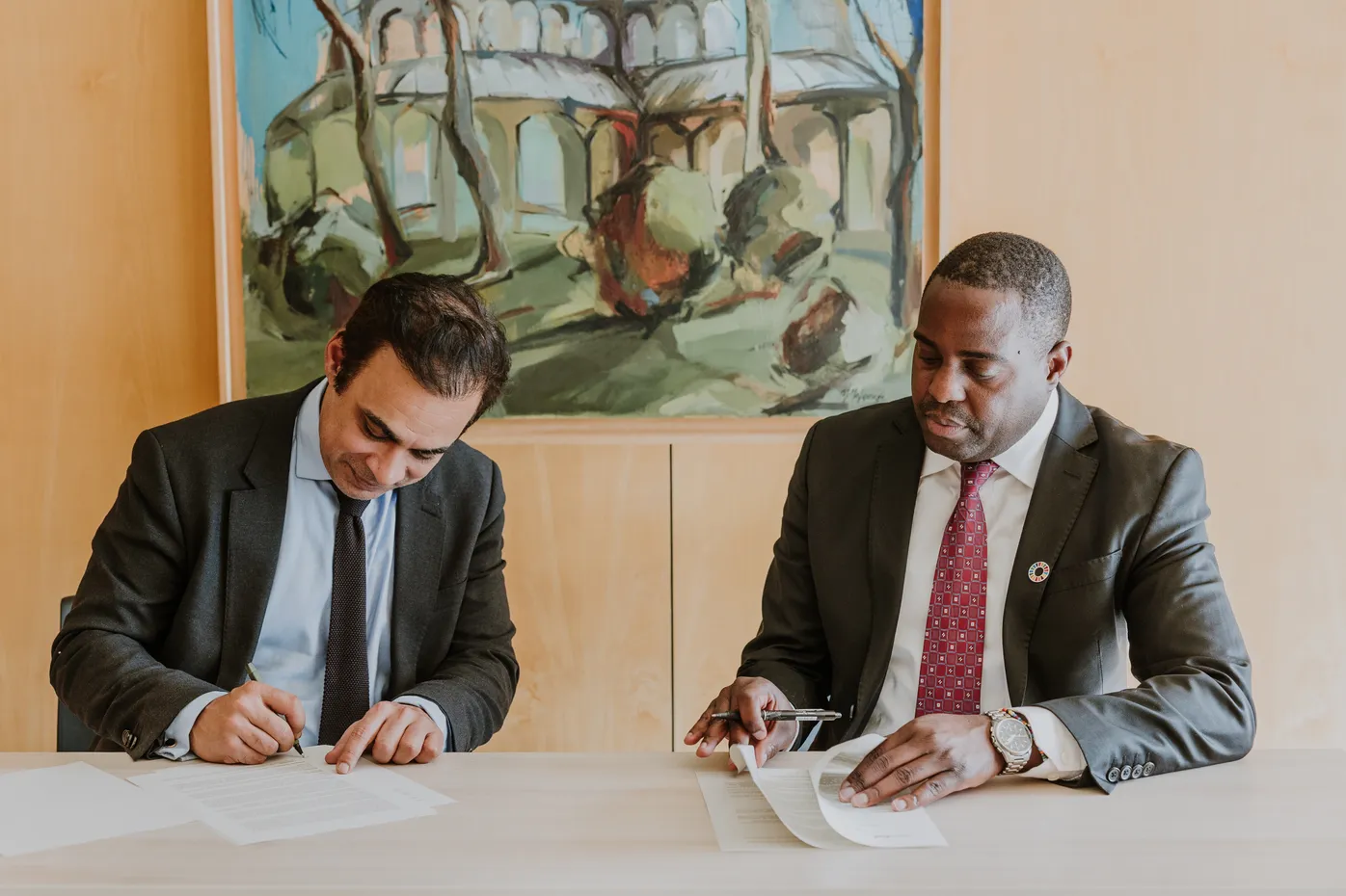 Neil Dhot and Alex Simalabwi signing MoU