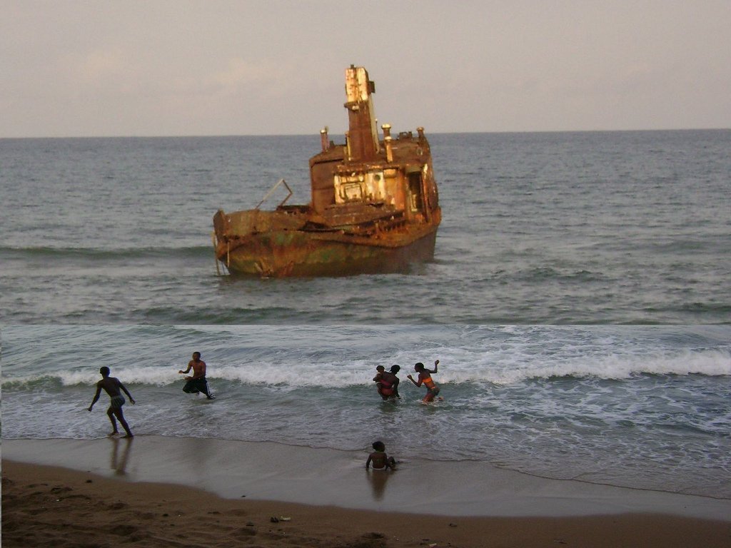 Boat and people in water